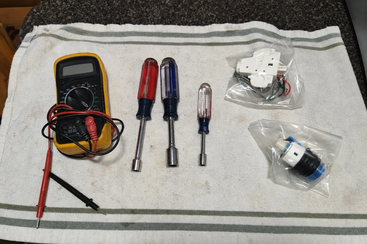 A commercial repair technician's tools laid out